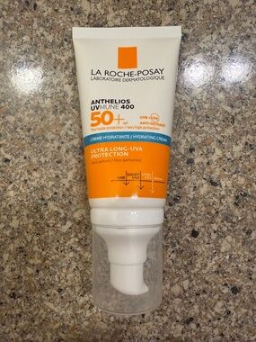 Anthelios UVMune 400 SPF 50+ Hydrating Cream in Orange and White